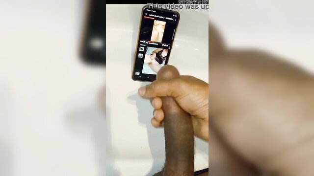 Person holding phone with explicit content