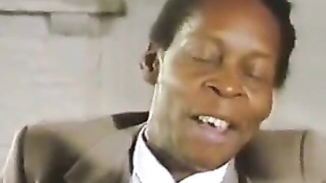 Black man in suit closeup from Salsa Break 1989 adult movie thumbnail