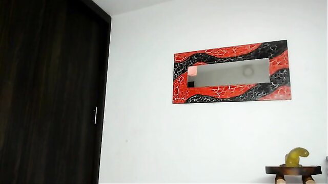 Tan-skinned cutie in red black frame mirror lap dances nude