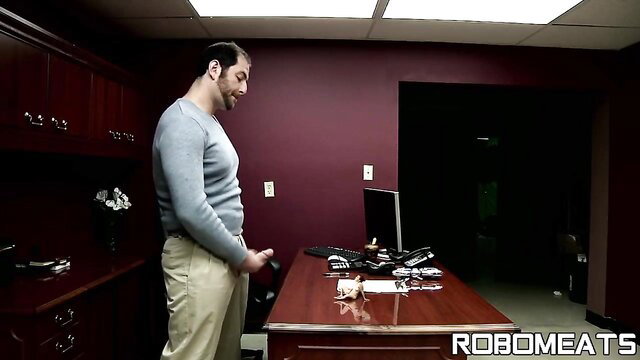 Handsome man in gray sweater pulls out huge cock in office