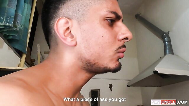 Shirtless Arab guy with huge shaved head smirking in kitchen, hot ass view