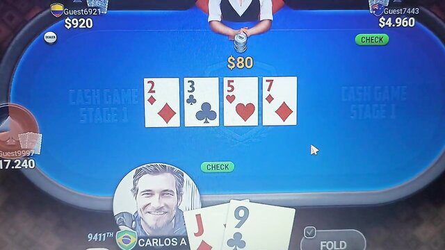 Hot guy playing strip poker with diamond flush on table, J9 clubs in hand