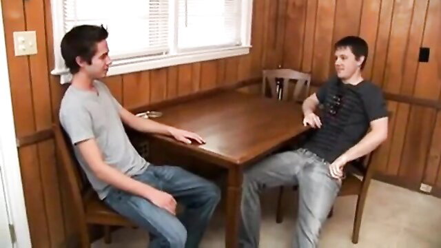 Two young twinks chatting intimately at table in 18th Bareback Birthday