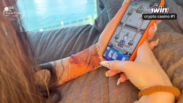 Hot stepsis with tattoos plays crypto casino on phone by pool, no panties