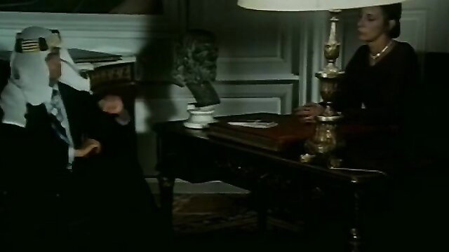 Vintage couple in elegant attire, mysterious desk encounter